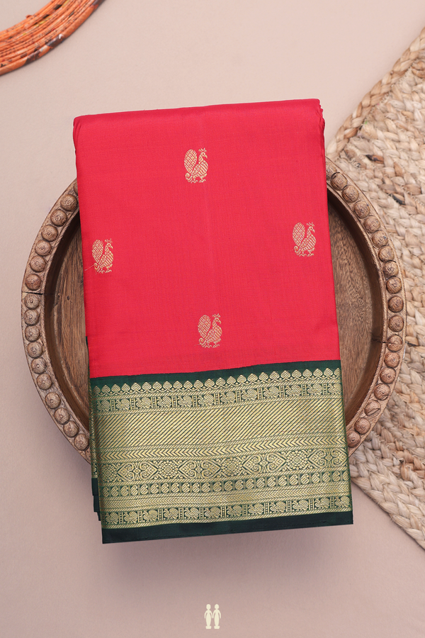 Kanchipuram Silk Saree In Crimson Red With Peacock Buttas