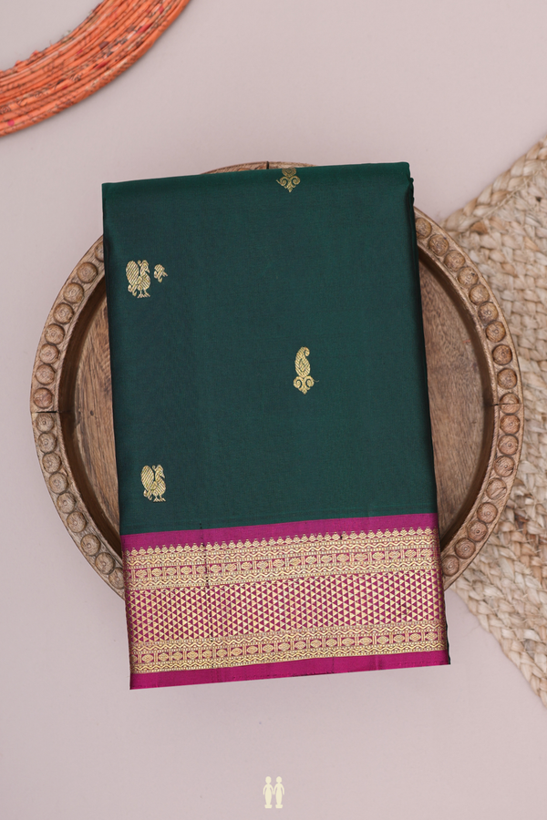 Kanchipuram Silk Saree In Dark Green With Peacock Buttas