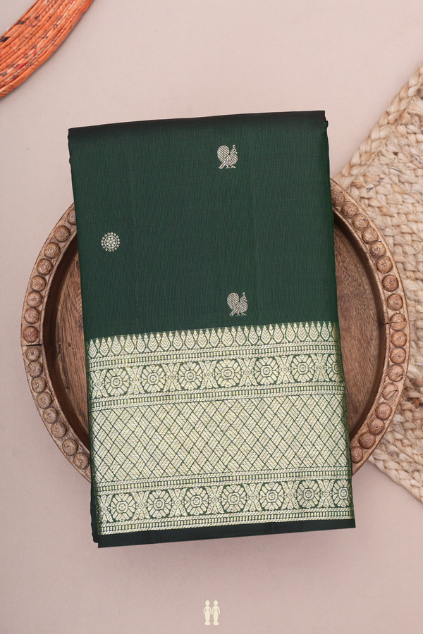Kanchipuram Silk Saree In Dark Green With Peacock Buttas
