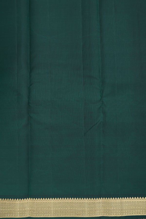 Kanchipuram Silk Saree In Dark Green With Peacock Buttas