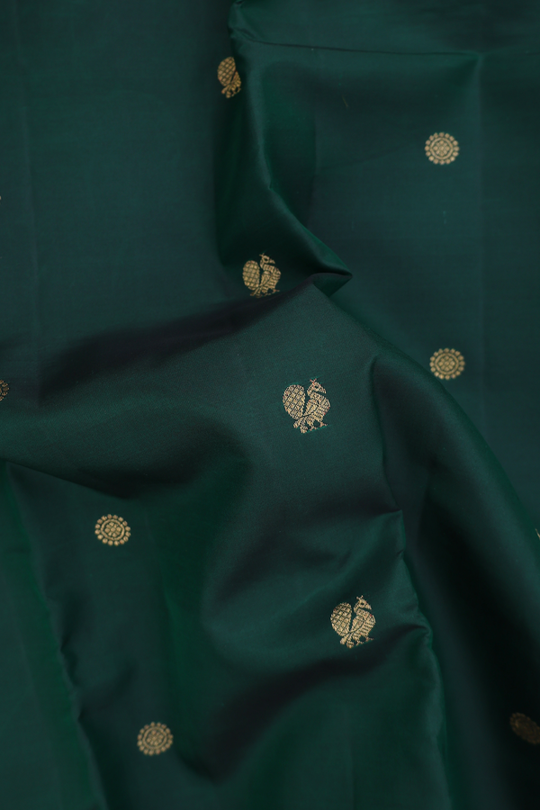 Kanchipuram Silk Saree In Dark Green With Peacock Buttas