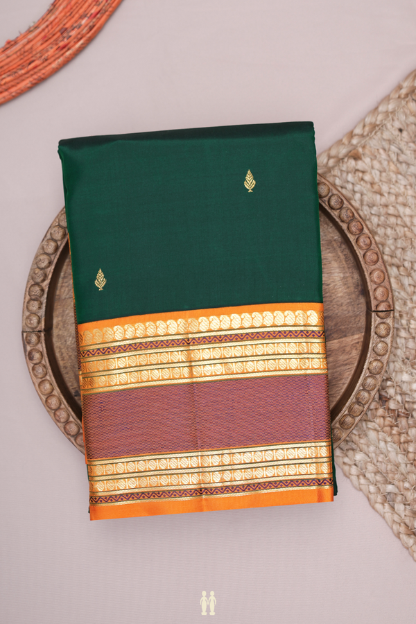 Kanchipuram Silk Saree In Dark Green With Zari Buttis