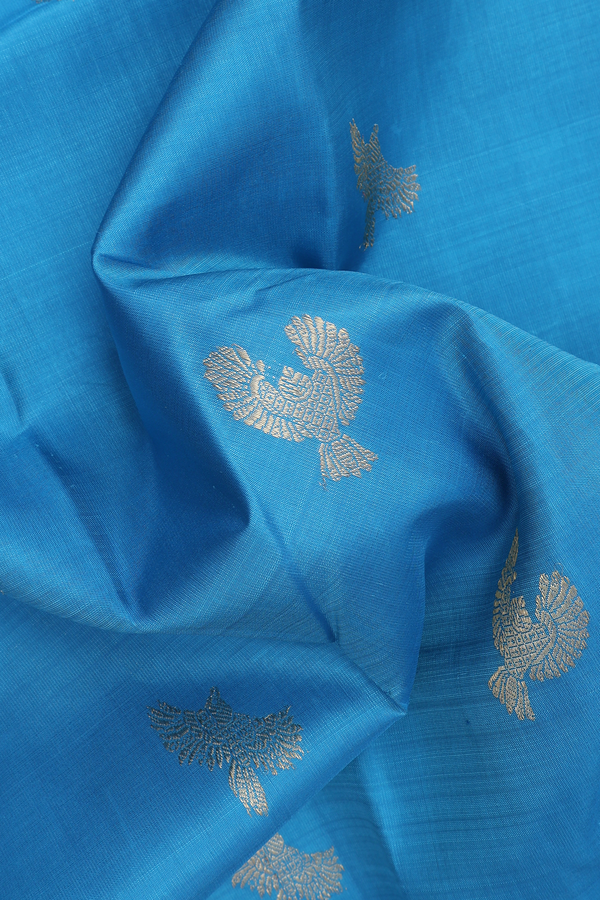 Kanchipuram Silk Saree In Deep Sky Blue With Parrot Buttas