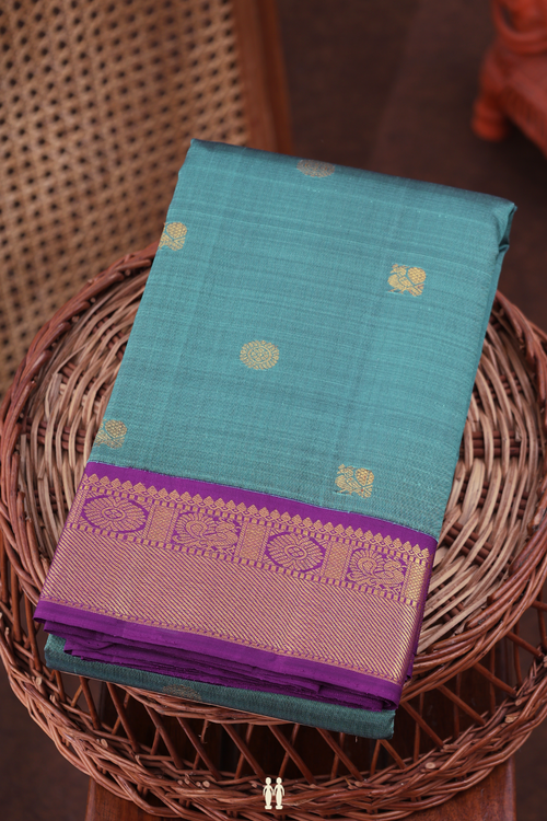 Kanchipuram Silk Saree In Dusty Teal With Peacock Buttas
