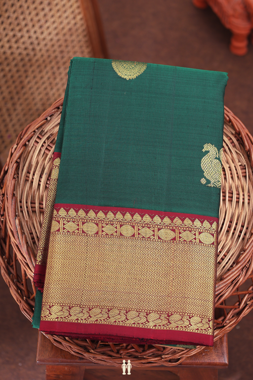 Kanchipuram Silk Saree In Forest Green With Peacock Buttas