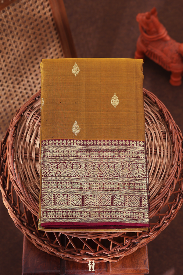 Kanchipuram Silk Saree In Golden Brown With Thilagam Buttas