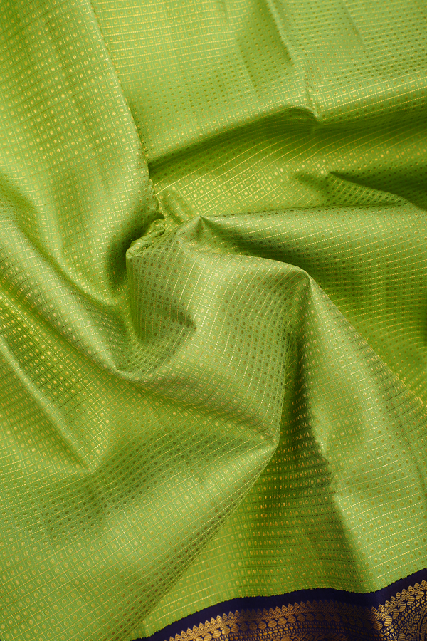 Kanchipuram Silk Saree In Green Along Checks With Buttis