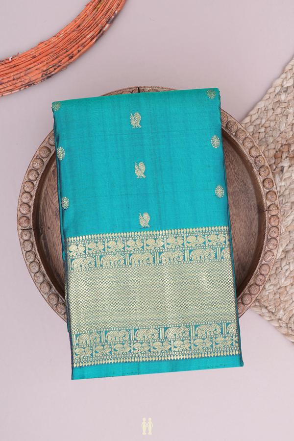 Kanchipuram Silk Saree In Green With Peacock Chakram Buttas