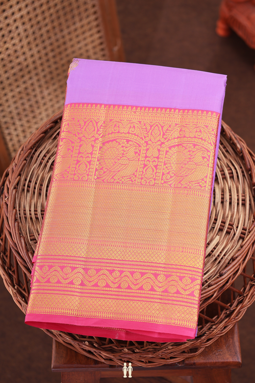 Kanchipuram Silk Saree In Lavender With Peacock Buttas