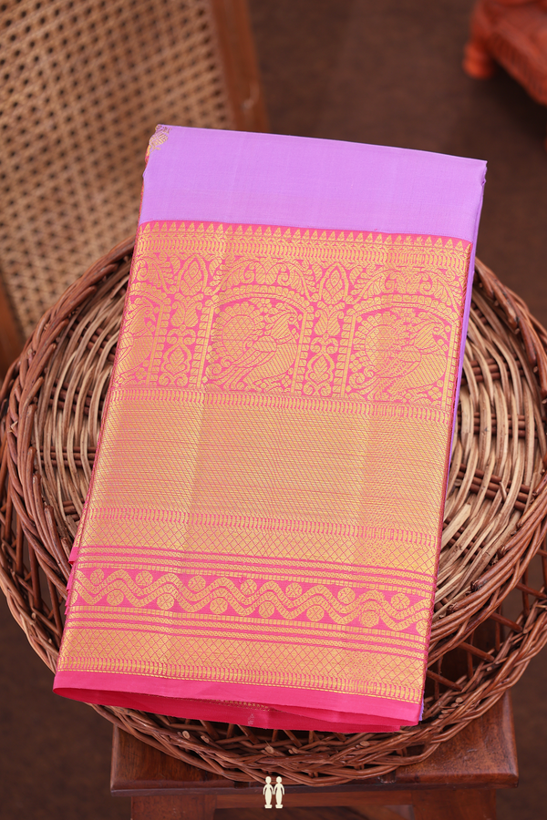 Kanchipuram Silk Saree In Lavender With Peacock Buttas
