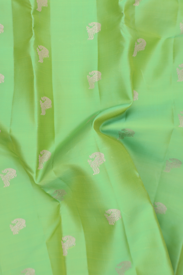 Kanchipuram Silk Saree In Light Green With Peacock Buttas