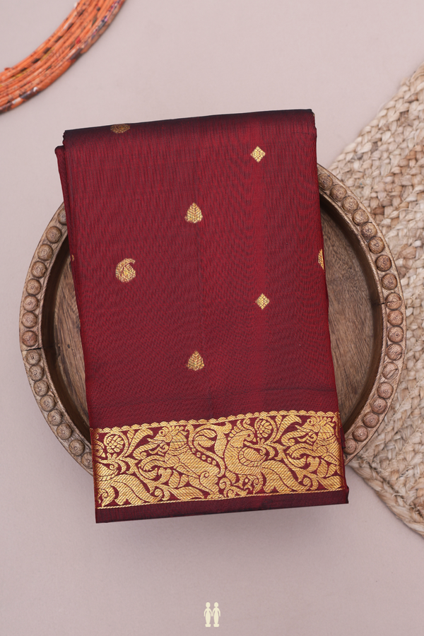 Kanchipuram Silk Saree In Maroon With Paisley Buttas