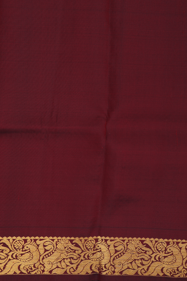 Kanchipuram Silk Saree In Maroon With Paisley Buttas