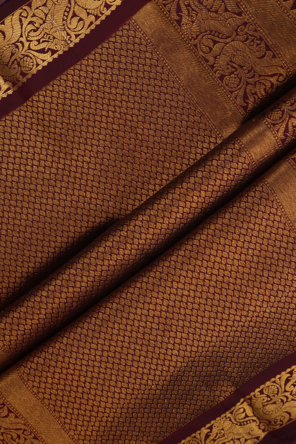 Kanchipuram Silk Saree In Maroon With Paisley Buttas