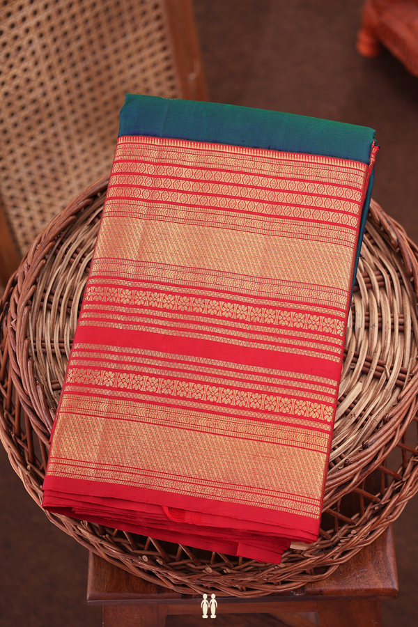 Kanchipuram Silk Saree In Midnight Green With Floral Buttas