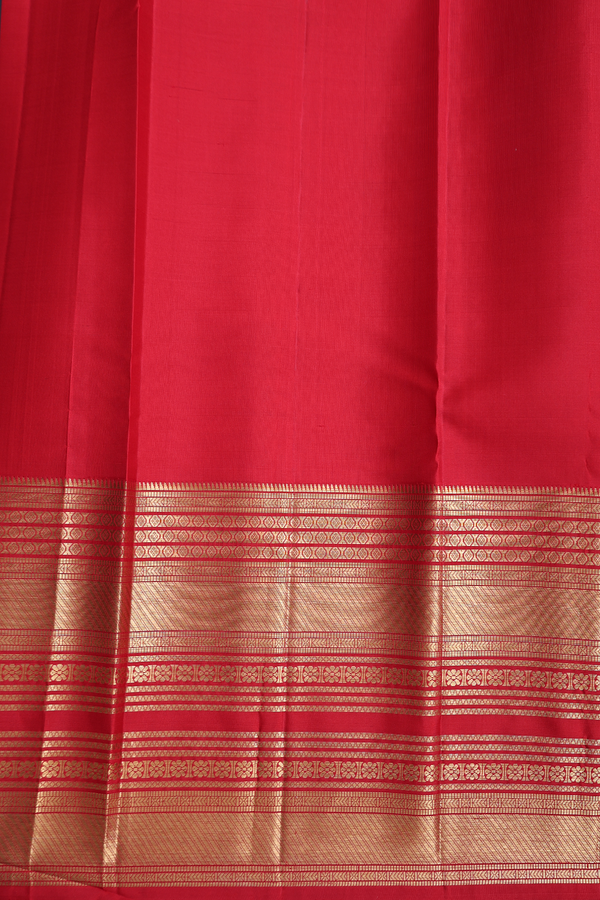 Kanchipuram Silk Saree In Midnight Green With Floral Buttas