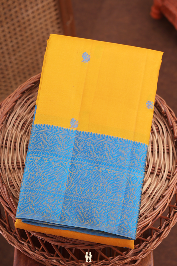 Kanchipuram Silk Saree In Mustard Yellow With Peacock Buttas