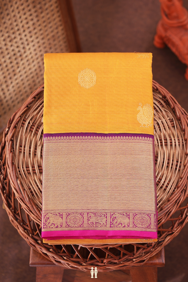 Kanchipuram Silk Saree In Mustard Yellow With Peacock Buttas