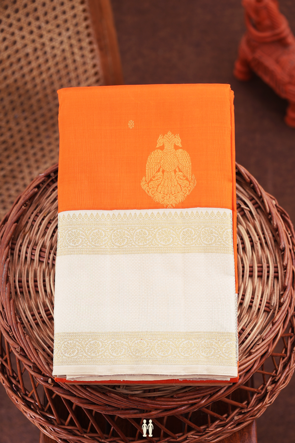 Kanchipuram Silk Saree In Orange With Floral Buttas