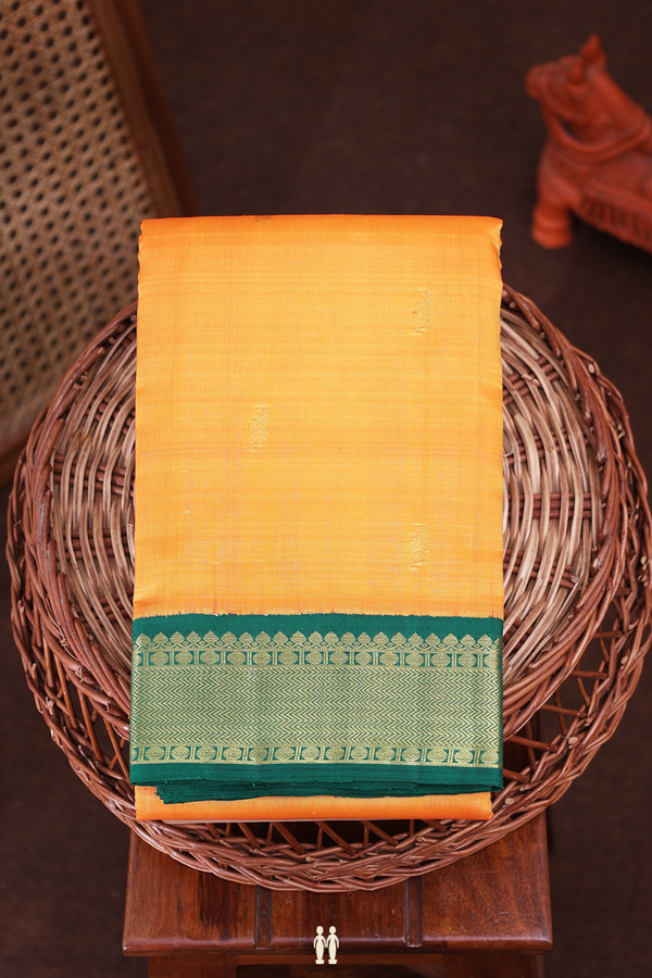 Kanchipuram Silk Saree In Orange With Floral Buttas