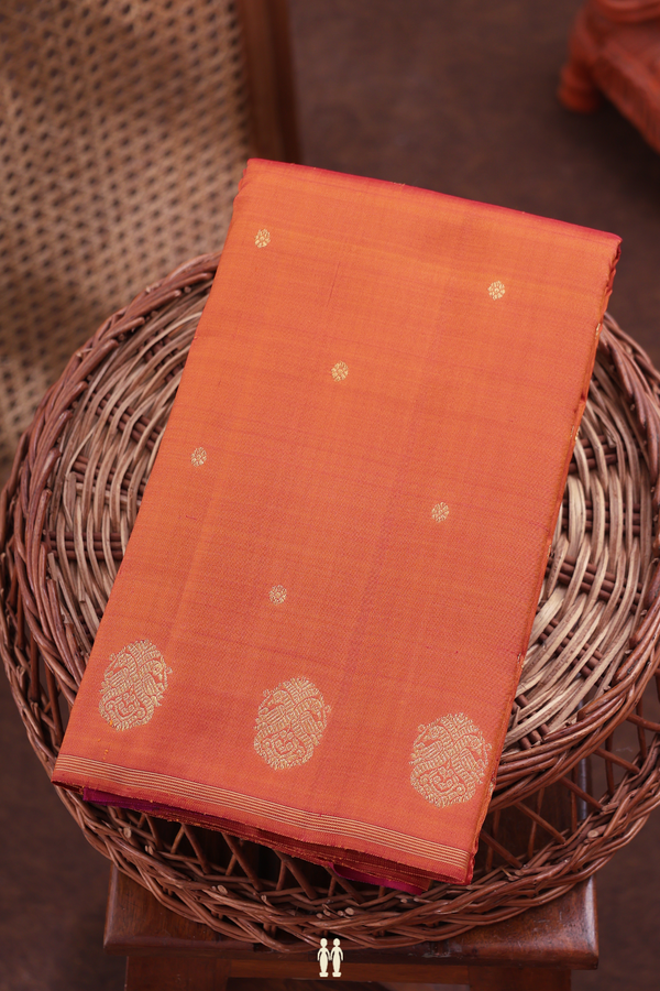 Kanchipuram Silk Saree In Orange With Floral Buttis