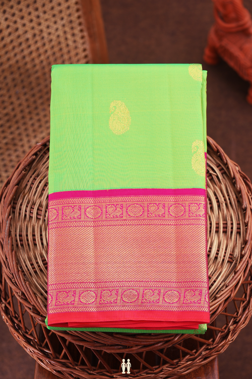 Kanchipuram Silk Saree In Parrot Green With Paisley Buttas