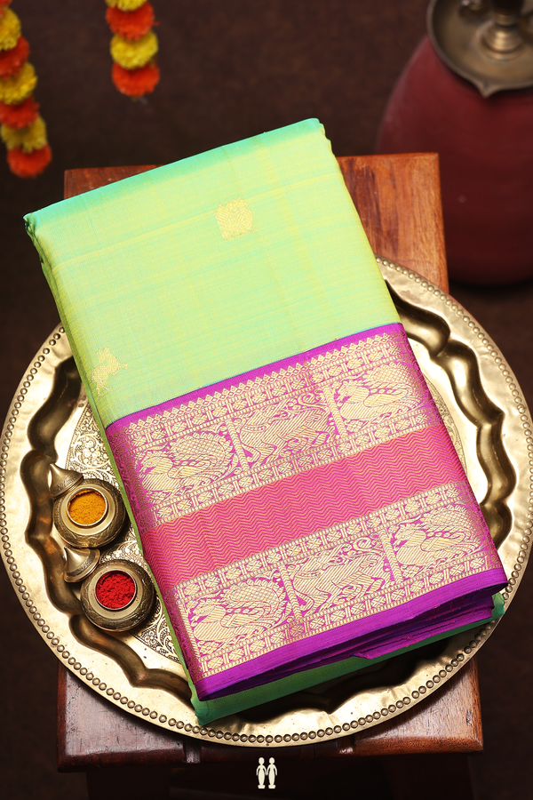 Kanchipuram Silk Saree In Parrot Green With Peacock Buttas