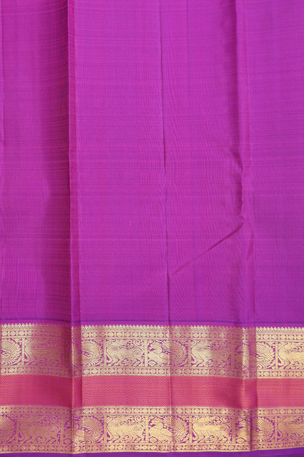 Kanchipuram Silk Saree In Parrot Green With Peacock Buttas