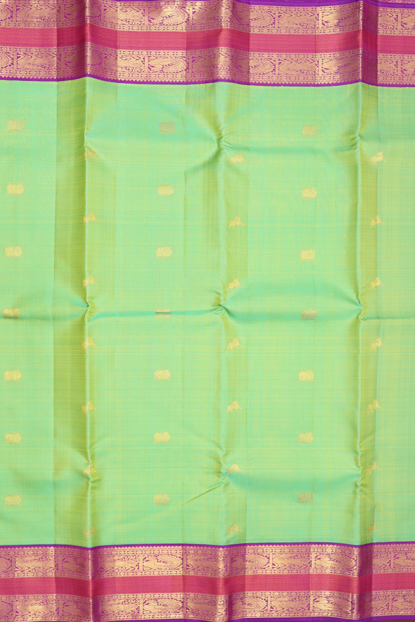 Kanchipuram Silk Saree In Parrot Green With Peacock Buttas