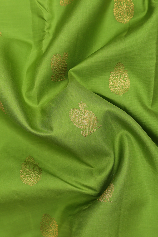 Kanchipuram Silk Saree In Parrot Green With Peacock Buttas
