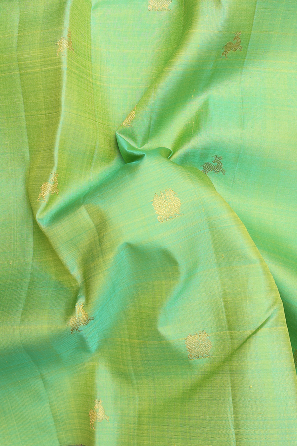Kanchipuram Silk Saree In Parrot Green With Peacock Buttas