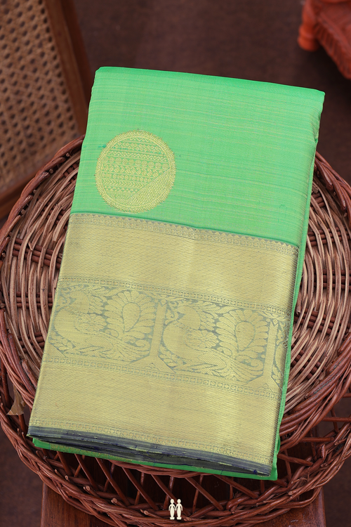 Kanchipuram Silk Saree In Parrot Green With Zari Motifs