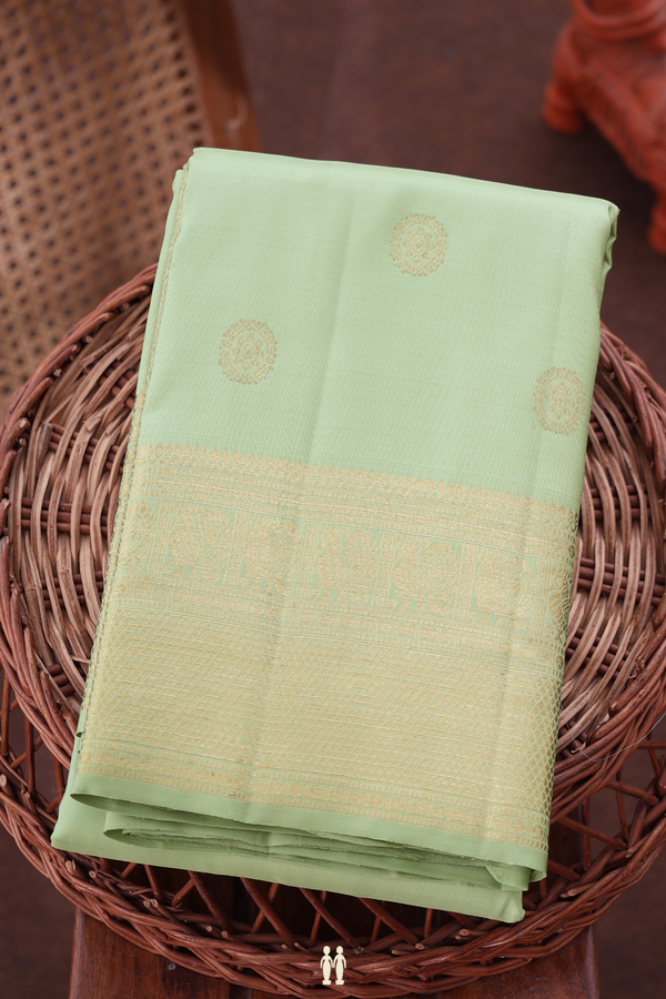 Kanchipuram Silk Saree In Pastel Green With Chakram Buttas