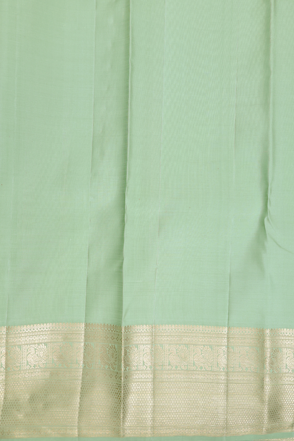 Kanchipuram Silk Saree In Pastel Green With Chakram Buttas