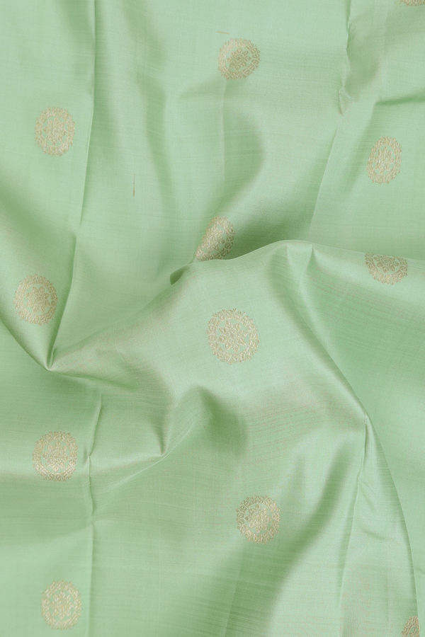 Kanchipuram Silk Saree In Pastel Green With Chakram Buttas