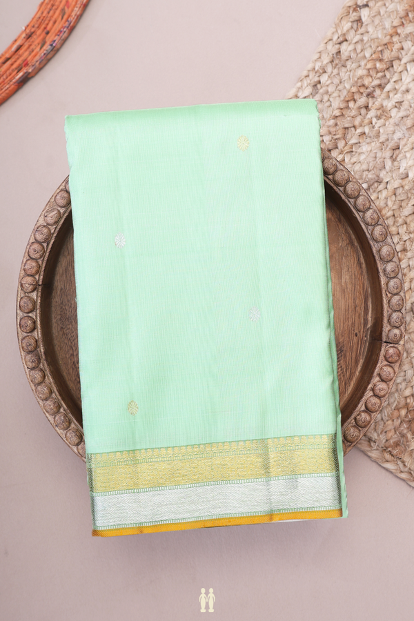 Kanchipuram Silk Saree In Pastel Green With Floral Buttis