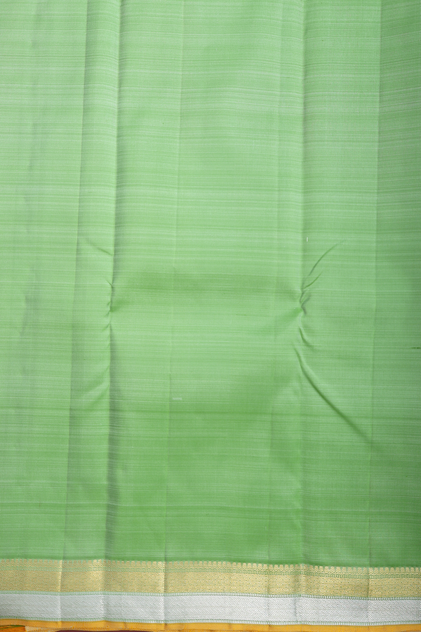 Kanchipuram Silk Saree In Pastel Green With Floral Buttis