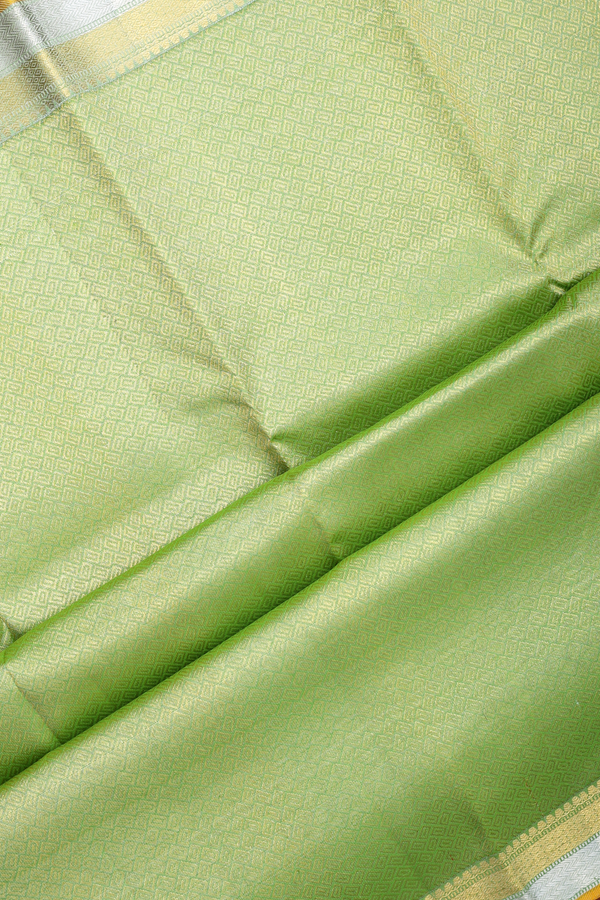 Kanchipuram Silk Saree In Pastel Green With Floral Buttis