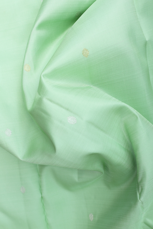 Kanchipuram Silk Saree In Pastel Green With Floral Buttis