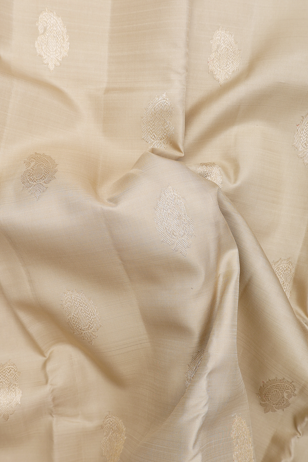 Kanchipuram Silk Saree In Pastel Khaki With Paisley Buttas