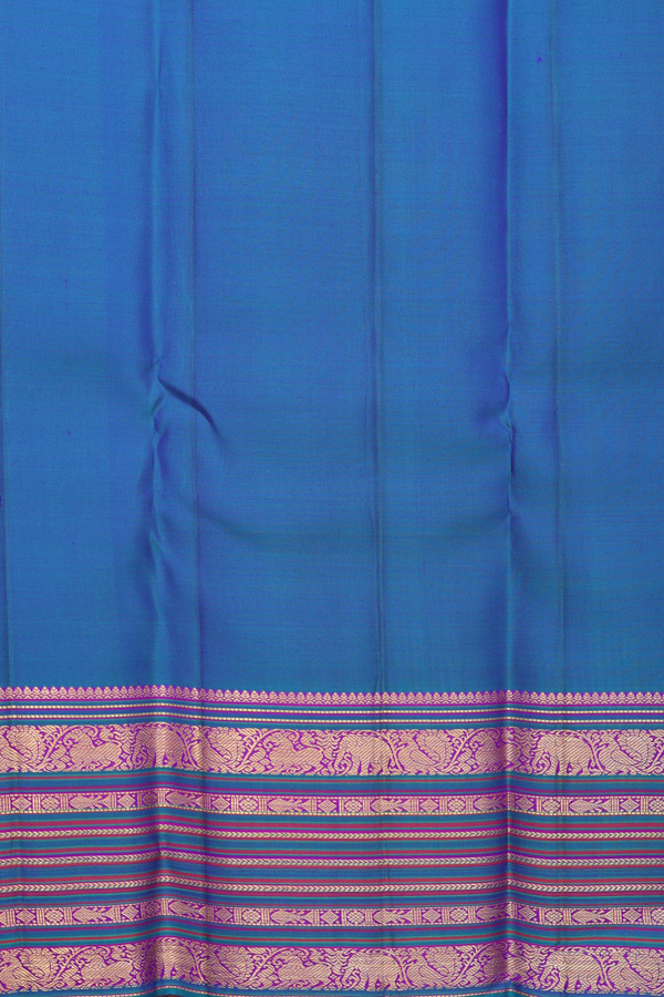 Kanchipuram Silk Saree In Peacock Blue With Floral Buttas
