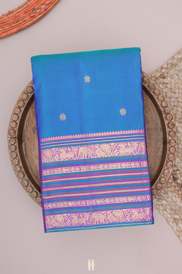 Kanchipuram Silk Saree In Peacock Blue With Floral Buttas