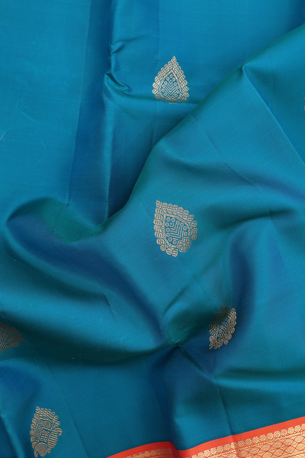Kanchipuram Silk Saree In Peacock Blue With Paisley Buttas