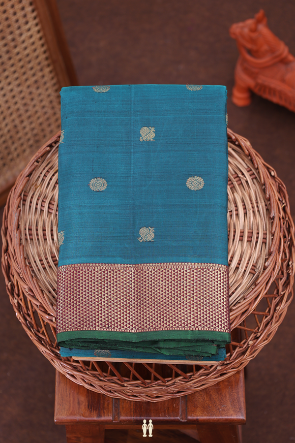 Kanchipuram Silk Saree In Pine Green With Peacock Buttas