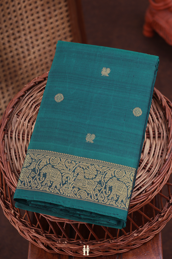Kanchipuram Silk Saree In Pine Green With Peacock Buttas