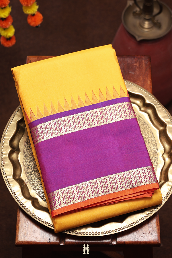 Kanchipuram Silk Saree In Plain Yellow With Contrast Border