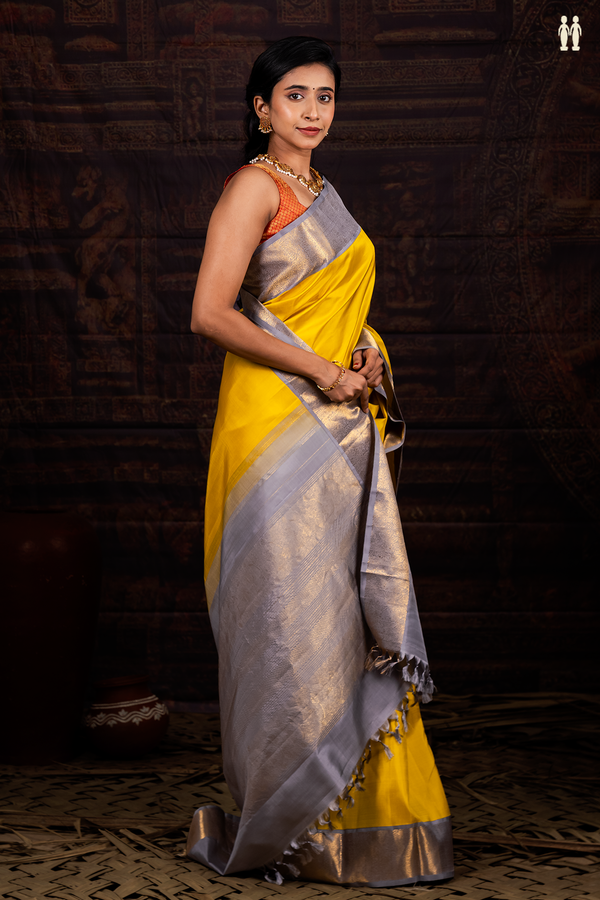 Kanchipuram Silk Saree In Plain Yellow With Contrast Border