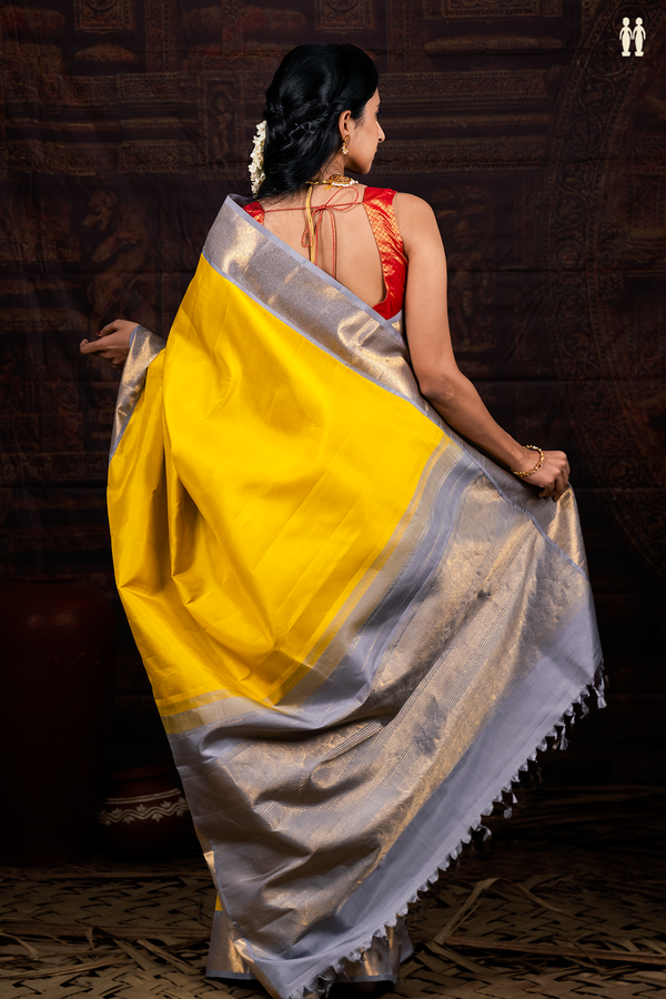 Kanchipuram Silk Saree In Plain Yellow With Contrast Border