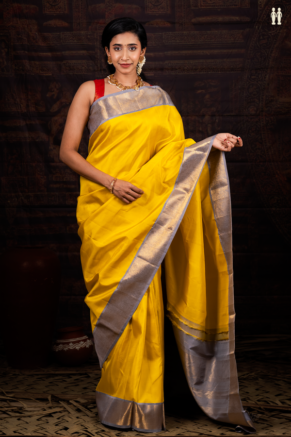 Kanchipuram Silk Saree In Plain Yellow With Contrast Border