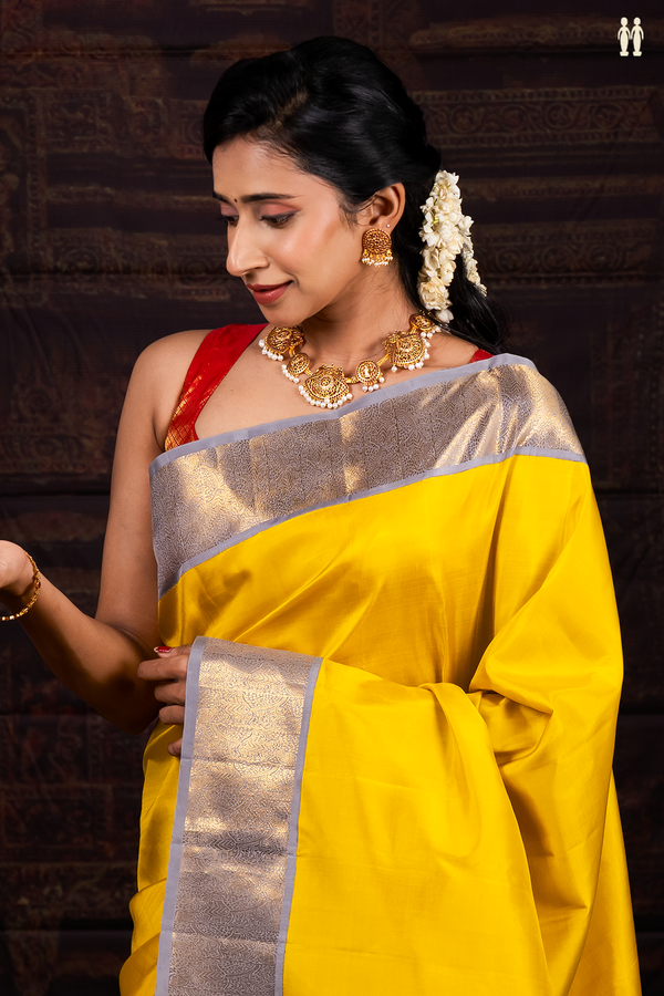 Kanchipuram Silk Saree In Plain Yellow With Contrast Border